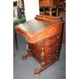 A Victorian walnut Davenport desk with stationery box, green leather rising top, four side drawers