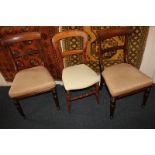 A pair of Victorian bar back dining chairs with upholstered seats, on turned legs, and another