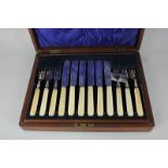 An Edward VII silver six piece fish service with white handles, in canteen box, maker Atkin