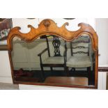 A Queen Anne style walnut fret cut over-mantel mirror with carved shell surmount, 65cm by 87cm