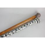 A silver topped walking cane, monogrammed F.C.H-L, 89cm (marks worn), together with a shell inlaid