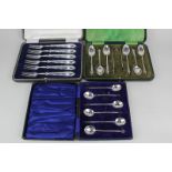 A cased set of six George V silver bean handled coffee spoons, maker Mappin & Webb, Sheffield, 1922,