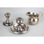 An Edward VII silver dwarf candlestick (a/f), another short candlestick, and a George V silver cream