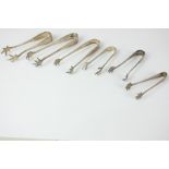 Six George V silver sugar tongs with claw grips, makers including W S Savage & Co, Sheffield 1901,