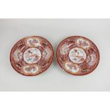 A pair of Japanese Imari porcelain plates depicting a Ho Ho bird, the surround with gilt foliage and