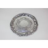 An Edward VII silver card tray, maker William Devenport, 1902, with chased floral design and