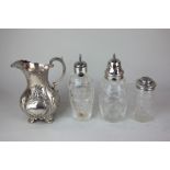 A Victorian silver mounted cut glass sugar caster, another silver mounted caster, an 800 silver