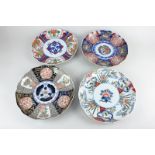 Four Chinese porcelain plates, all with scalloped rims and bright colours with gilt embellishment,