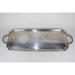 A George VI silver two-handled tray, rectangular shape with moulded border and shaped corners,