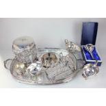 A collection of silver plate to include a two-handled tray, a tea strainer, a toast rack, three