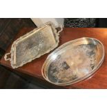 A silver plated two-handled rectangular tray with cast fruiting vine border, scroll handles and