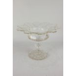 A 19th century cut glass pedestal dish with flared scalloped rim, 20cm high