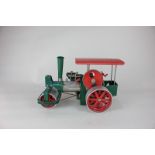 A Wilesco 'Old Smokey' steam roller in green, red and chrome, marked Made in Western Germany