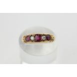 A ruby and diamond five stone ring in 18ct yellow gold