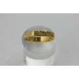 An 18ct gold wedding ring, floral engraved octagonal shape, 5.7g