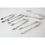 Five Victorian silver sugar tongs, makers including Haseler Brothers, Birmingham 1900, and Holand,