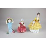 Two Royal Doulton porcelain figures of ladies, Lavinia, 14cm, and Coralie, 19cm, together with a