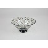 An Orrefors glass bowl, circular pedestal form with black spiral lace pattern, etched mark to