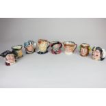 A collection of eight small Royal Doulton character jugs to include The Falconer, Falstaff, Old King