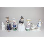 A Royal Copenhagen porcelain figure of a girl, a pair of Danish 'Jus' figures, and three other