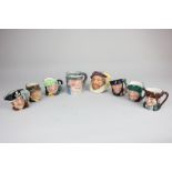 A collection of six miniature Royal Doulton character jugs to include Sairey Gamp and Scaramouche,