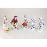 Two pairs of Dresden style porcelain figures of flower sellers, and a similar figure of a gallant,