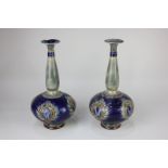 A pair of Doulton Lambeth vases by Bessie Newbery, each with tapered neck and globular body, blue