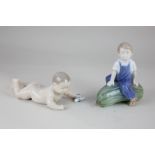 A Royal Copenhagen porcelain figure of a boy seated on a large marrow, 12cm high, and another of a