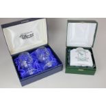 A cased pair of Waterford Crystal drinking glasses in presentation box, and a boxed china tea