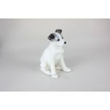 A Russian porcelain figure of a seated dog, with base mark and inscribed 'Made in USSR', 20cm high