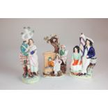 Three Staffordshire pottery figure groups including two children beside a water fountain, 21cm,