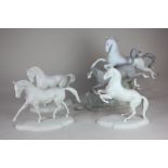 A Lladro figure group of two galloping horses, 38cm, (a/f), and three white bisque porcelain