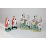 Two Staffordshire pottery figure groups of a maiden pouring wine for a gentleman, 18.5cm, and a pair