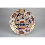 An 18th century British porcelain Imari plate with floral decoration in rust, blue and gilt on white