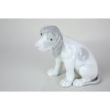 A German porcelain figure of a pointer puppy, probably Heubach Lichte, indistinct marks to base,