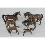 Six Beswick porcelain models of horses, a stocky jogging mare (H855), an Arab (No 1265), a Shire