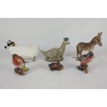 A collection of six Beswick porcelain models, a black-faced ram (No 3071), a donkey foal (No