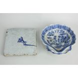 A Delft blue and white wall tile with single knight on horseback, 12.5cm, and a Willow pattern pearl