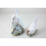 Two Royal Copenhagen porcelain models of animals, comprising a pair of white doves, 14cm, and a