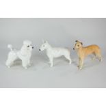 Three Beswick porcelain models of dogs, a greyhound, Jovial Roger (No 972), a bull terrier, Romany