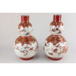 A pair of Japanese Kutani porcelain gourd shaped vases decorated with flowers and birds, character