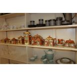 A collection of Price Brothers cottage table wares including tea, coffee pots, biscuit box, three-