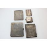 A George V silver cigarette case with engine turned decoration and mounted gilt metal initials,