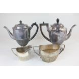 A Mappin and Webb silver plated hot water pot, a similar milk jug and sugar bowl, and a silver