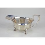 A George VI silver cream jug, faceted form on three scroll feet, 4.5oz, 16cm