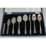 An unusual Elizabeth II cased set of silver and unmarked white metal spoons displaying the evolution