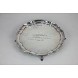 A modern silver salver with piecrust border and presentation inscription, London 1979