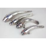 Four unusual silver plated articulated fish ornaments with flexible bodies and side fins, red