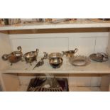 A collection of silver plated tableware to include a sauce boat, matching cream jug and sugar