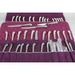 A set of twelve silver handled Asprey table knives, a set of eight similar silver plated Asprey